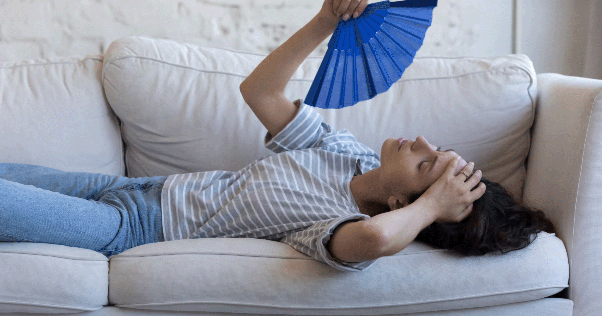 Plan for a cooler more comfortable home this summer. Image of a home owner overheated at home.