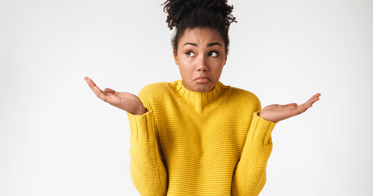 attic-fan-vs-wholehouse-fan woman confused by the difference between an attic fan and a wholehouse fan.